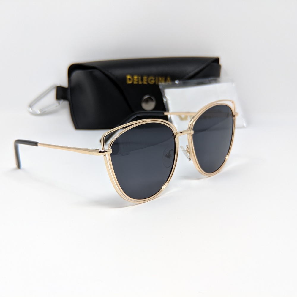 Stylish black sunglasses with bold gold trim - Picture 2 of 4